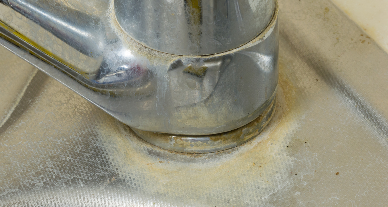 Close-up of deep cleaning process removing limescale, featured in a content banner for a cleaning blog.